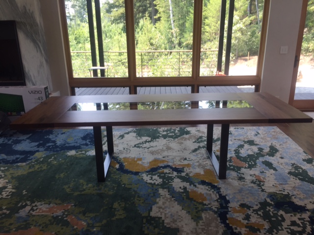 Glass, walnut and steel dining table in Teton Village, WY residence